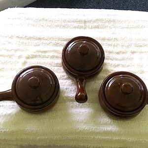 3 clay pots with lids